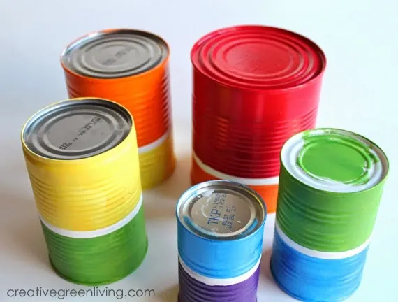 How to make a recycled DIY windchime from tin cans Empty cans painted in rainbow colors